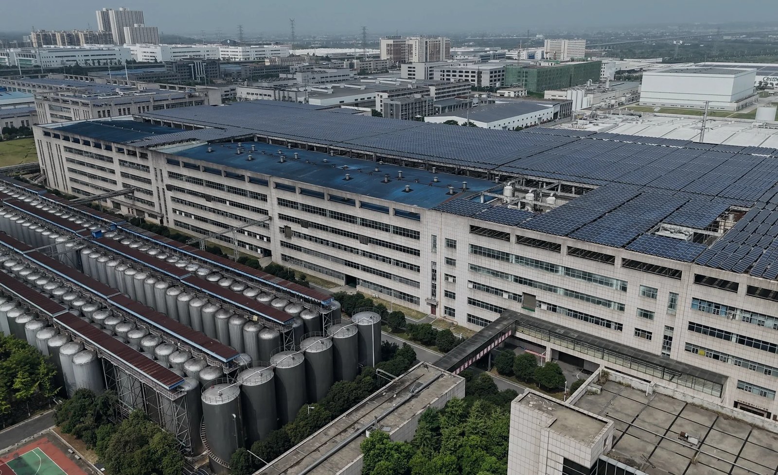 Large industrial facility with rooftop solar panels